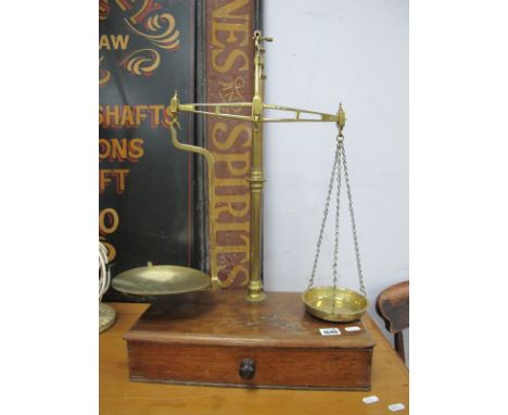 XIX Century Brass Scales, on a mahogany base with drawer and weights.