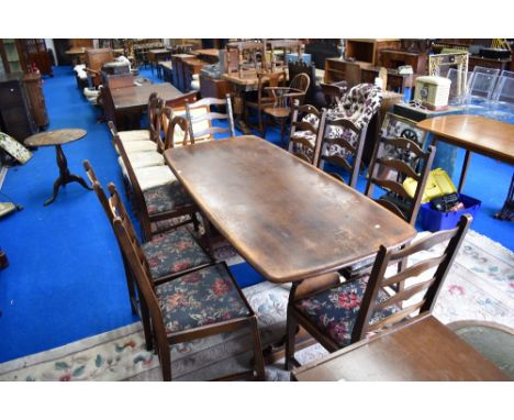 A dark stained Ercol refectory style dining table and set of eight ladder back dining chairs, table approx. 178 x 80cm, in st