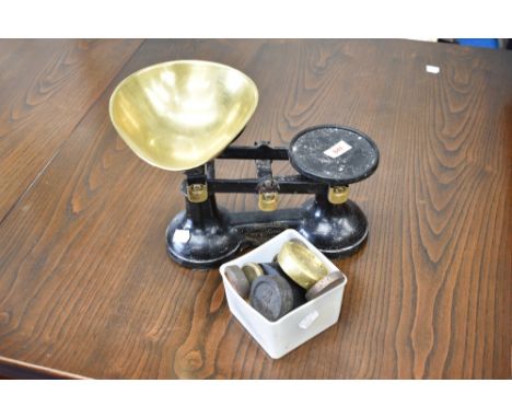 A traditional kitchen scales labelled The Viking with brass dish and selection of weights