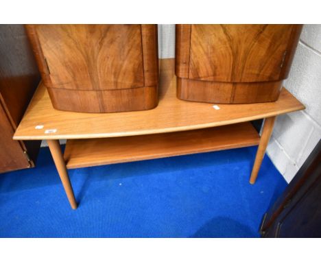 A vintage light teak coffee table with undershelf