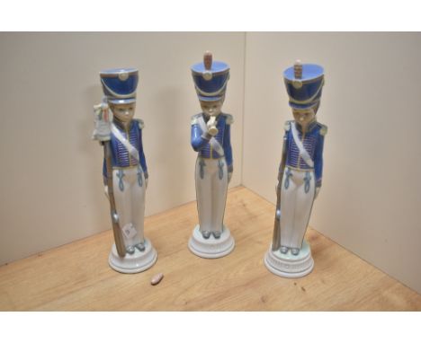 A group of three Lladro porcelain Cadet Soldier figures, comprising soldier with bugle, soldier with rifle and soldier with f