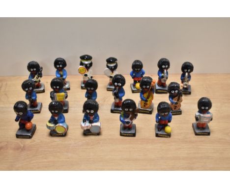 A collection of nineteen Robertson's Jam advertising figures, mainly band members but including two lollipop ladies and three