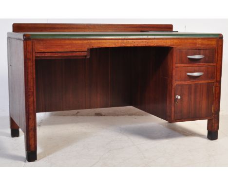 A vintage 20th century oak desk having a stub gallery back, green leather writing skiver with chamfered edges, desk tidy to t