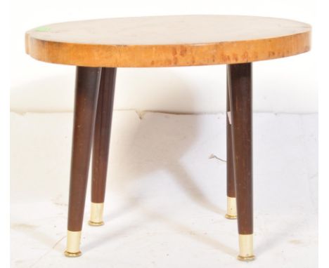 A retro vintage mid 20th Century living edge tree trunk coffee table. The table being of circular form, raised with tapering 