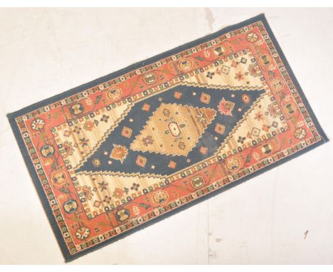 A&nbsp; vintage 20th century Persian Islamic rug carpet having a central medallion set within a geometrically patterned borde