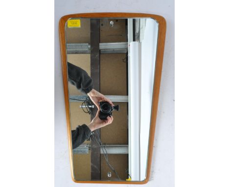 A vintage retro mid 20th century circa. 1950's atomic style wall hanging mirror with mirror glass on teak wood mount with fac