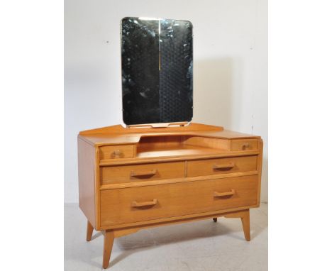 E. Gomme- G Plan - Brandon Range - A retro vintage 20th Century light oak dressing table chest having a central mirror panel 