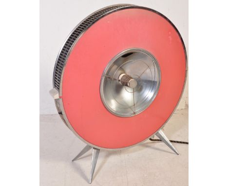 A retro vintage mid 20th century circa 1960s Space Age Atomic sofono heater of circular form having red enamel sides and rais