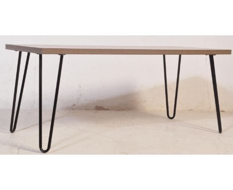 A retro vintage industrial style occasional coffee table with drift wood effect top raised over black ebonised hairpin legs.&