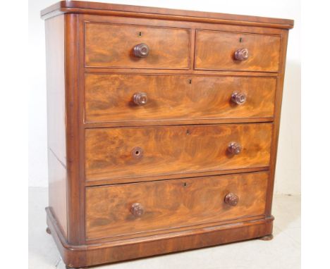 A 19th century Victorian mahogany chest of drawers. Raised on a plinth base with 2 over 3 configuration having knob handles a