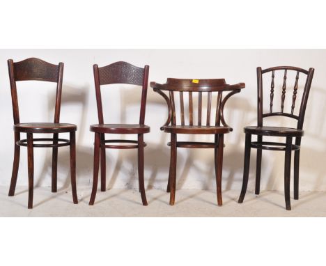 A collection of four 20th century Thonet cafe dining chairs comprising of a rail back cafe chair with circular panel seat rai