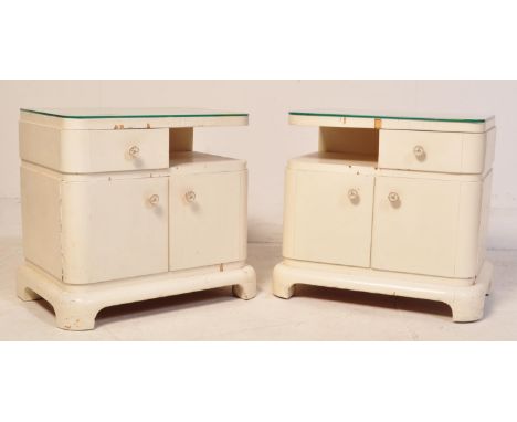 A pair of early 20th century Art Deco circa. 1930's Compactom beside cabinets painted in a white colourway on bracket feet wi