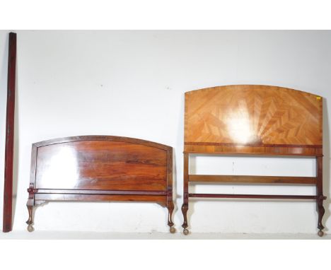 An early 20th century Art Deco circa 1930s walnut bed having parquet sunburst decoration to the headboard and footboard.