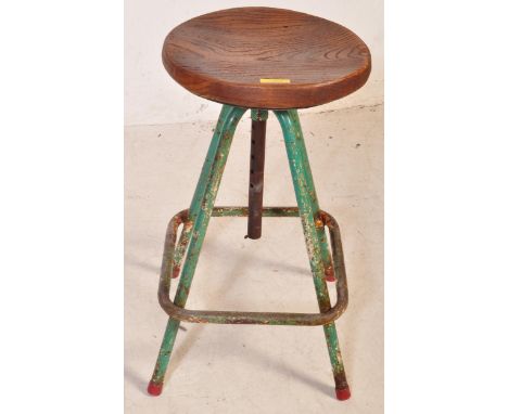 A vintage retro mid 20th century adjustable stool having an elm seat (later addition) atop a tubular frame painted in a green