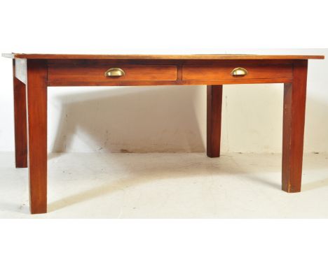 A 1930s early 20th century Art Deco era government oak desk / table having a flared top, over two drawers with brass pulls ra