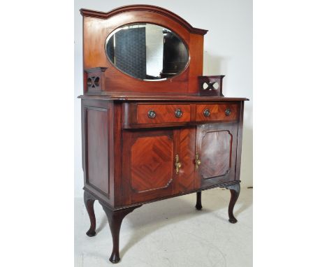 An early 20th century Edwardian circa. 1900's mirror back sideboard credenza. The sideboard&nbsp; having an oval mirror set w