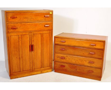 A vintage 20th century Art Deco style golden oak tallboy having a twin cupboard raised over a bank of two drawers. Together w