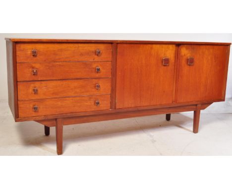 A vintage retro mid 20th century circa. 1960's sideboard credenza having a bank of four rectangular drawers, each with square