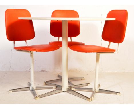 A retro vintage mid 20th century circular dining table raised on a chrome four point base. Together with three retro dining c