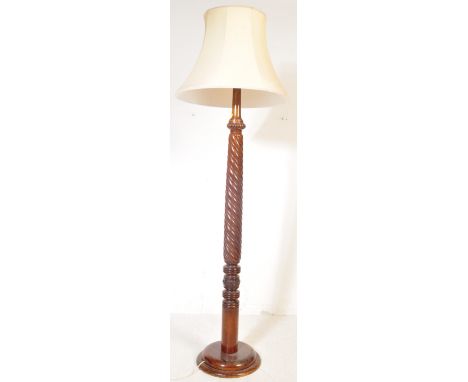 A Victorian 19th century mahogany barley twist standard lamp being converted from a bed post raised on a terraced base. Compl