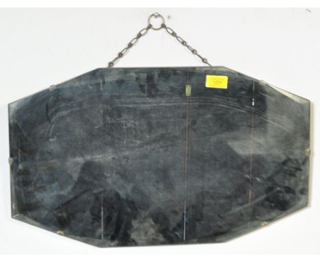 A vintage circa. 1940's wall hanging mirror of oval type form with a bevelled edge and hanging chain to the reverse.&nbsp;