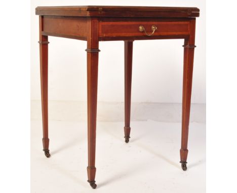 A 19th Century Victorian mahogany envelope card / games table having a four section folding metamorphic top with inlaid borde