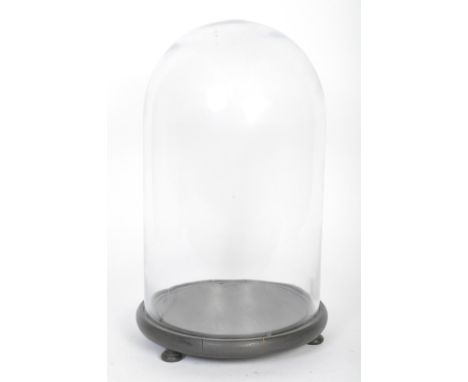 A vintage 20th century glass specimen / taxidermy display dome having an ebonised circular base with channel inset for the el