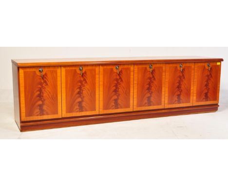 Meredew - A retro vintage mid 20th century circa. 1960's teak wood sideboard credenza. The sideboard having shelved interior 
