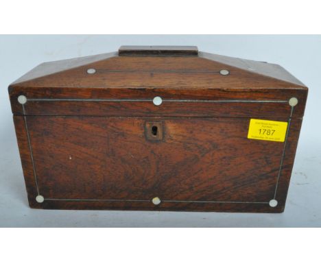 A 19th century Victorian mahogany sarcophagus tea caddy having empty wooden cartouche to lid centre with inlaid mother of pea