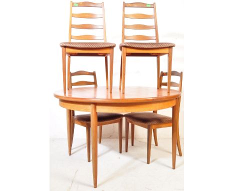 G Plan - A mid 20th Century dining suit comprising of four chairs &amp; a table. The teak table being of circular form with a