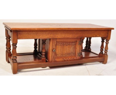 Old Charm - A vintage 20th century oak Old Charm coffee table / nest of tables. The coffee table having a central cupboard wi