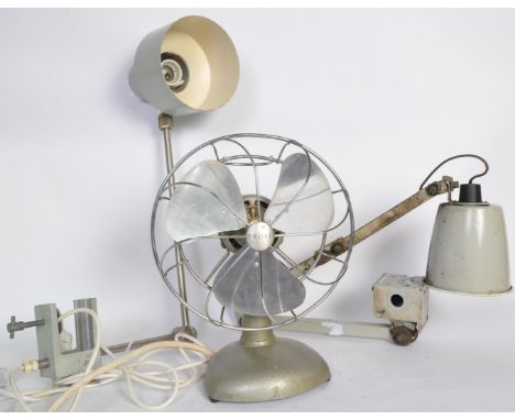 Two vintage retro mid 20th century grey desk lamps, together with a 1960's Frost table fan. Measures 67cm length.&nbsp;