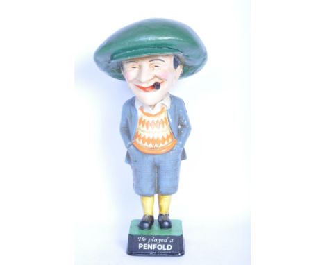 A vintage 20th century cast iron the Penfold man golf advertising statue. The item being hand painted with plinth base readin