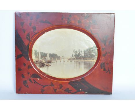 An early 20th century circa. 1920's Chinese lacquered red and black hand painted frame with tondo mount. The frame having a p