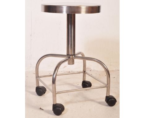 A vintage retro mid 20th century industrial chrome dressing table stool&nbsp; having a circular seat raised upon a tubular ch