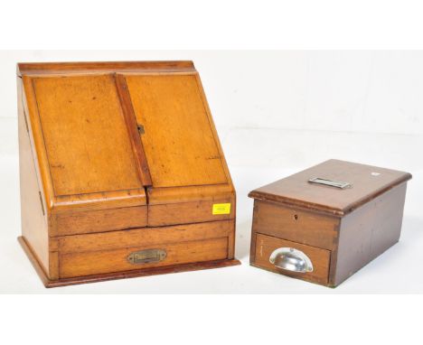 A 19th century Victorian oak desk tidy having double doors opening to reveal a fully appointed interior raised on a plinth ba