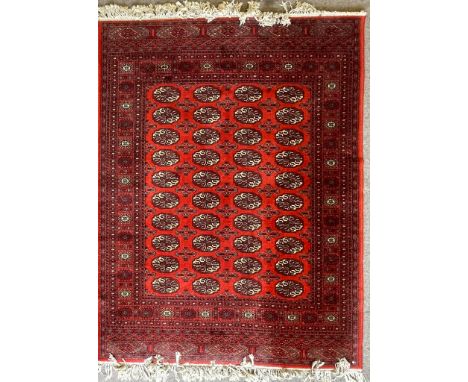 A vintage 20th century Persian Islamic rug / carpet having a central medallion with polychrome floral detailing set within a 