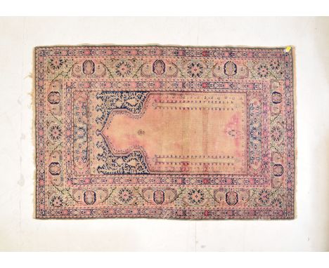 A vintage 20th century Persian Islamic rug carpet having a having a central Islamic motif set within a geometrically patterne