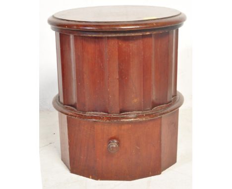 A Victorian 19th century mahogany cylindrical library step commode having canted edges and pull out step with circular handle