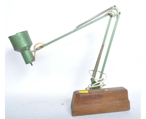 A retro vintage mid century angle poise desk lamp in a green colourway upon a wooden block base.&nbsp;