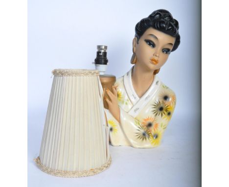 A vintage 20th century Chinese Oriental style lamp having a stand in the form of a lady holding the bulb wearing a kimono dec