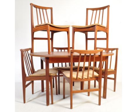 A retro vintage mid 20th century Portwood teak table and chairs. The extendable dining table is of circular form having a ext