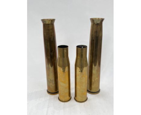 Two WWII 40mm Bofors shells, dated 1944 and 1943, tops flared, together with two WWII 37mm M16 anti-tank shells dated 1941, a