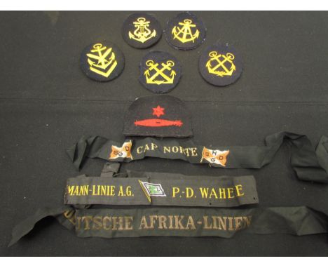 A quantity of Third Reich era German Kriegsmarine cloth trade badges including torpedoman, and a quantity of cap tallies. Pro