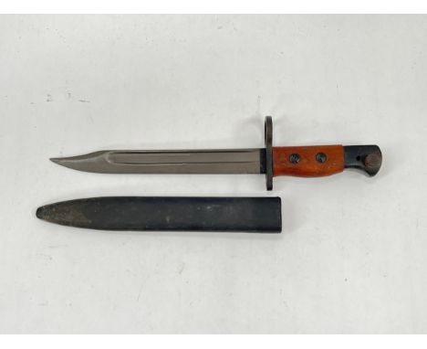 A British No. 5 Jungle Carbine bayonet by Wilkinson marked WSC, with scabbard 