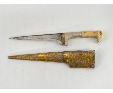 A Persian Pesh Kabz push dagger, bone hilt joining a tapering flat-top blade, within an embossed brass scabbard 