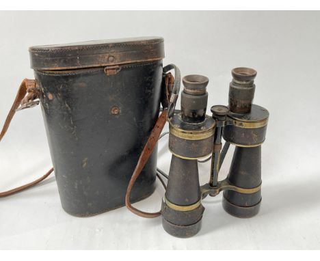A pair of Imperial German 7xL50 marine binoculars by Leitz, serial number 6870, together with black leather case stamped with
