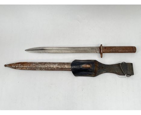 A WWI German Ersatz (Emergency) Mauser bayonet with scabbard and black leather belt frog, corroded 