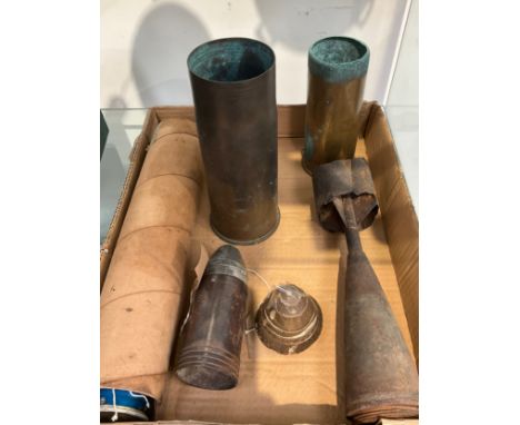 A quantity of mixed military ordnance including practice bomb tail fin and WWI shell case 