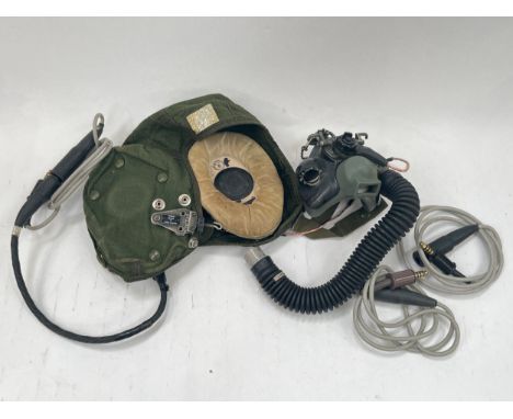 A 1970's RAF helmet 22C/1301768 size 4, with oxygen mask P1B 6D/3040 